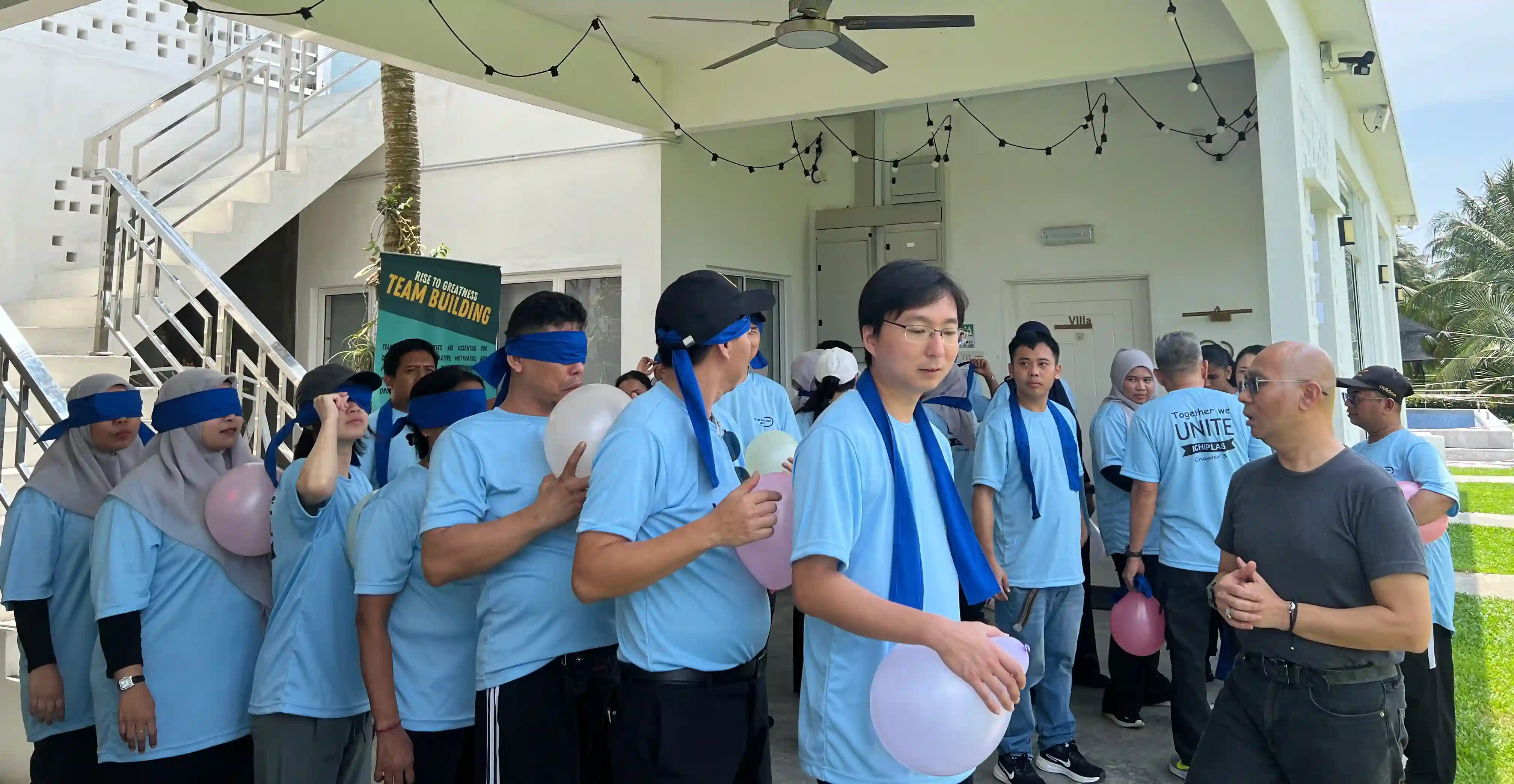 Ichiplas team members doing blindfolded trust walk exercise